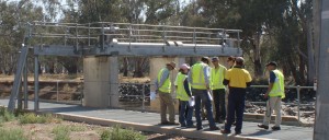Lachlan Riverine Working Group examining and discussing the fishway installed at Bumbuggan Weir (Image: Patrick Driver, NoW, 8 November 2013)